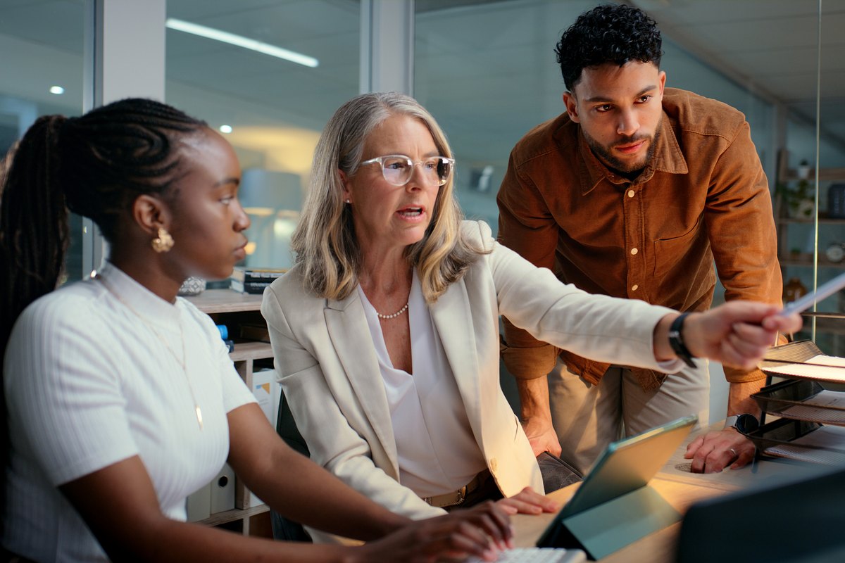 Colleagues reviewing analytics together at a workstation